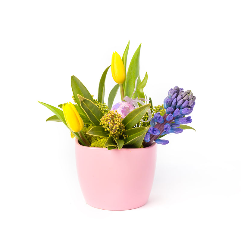 easter floral arrangement in a pink pot